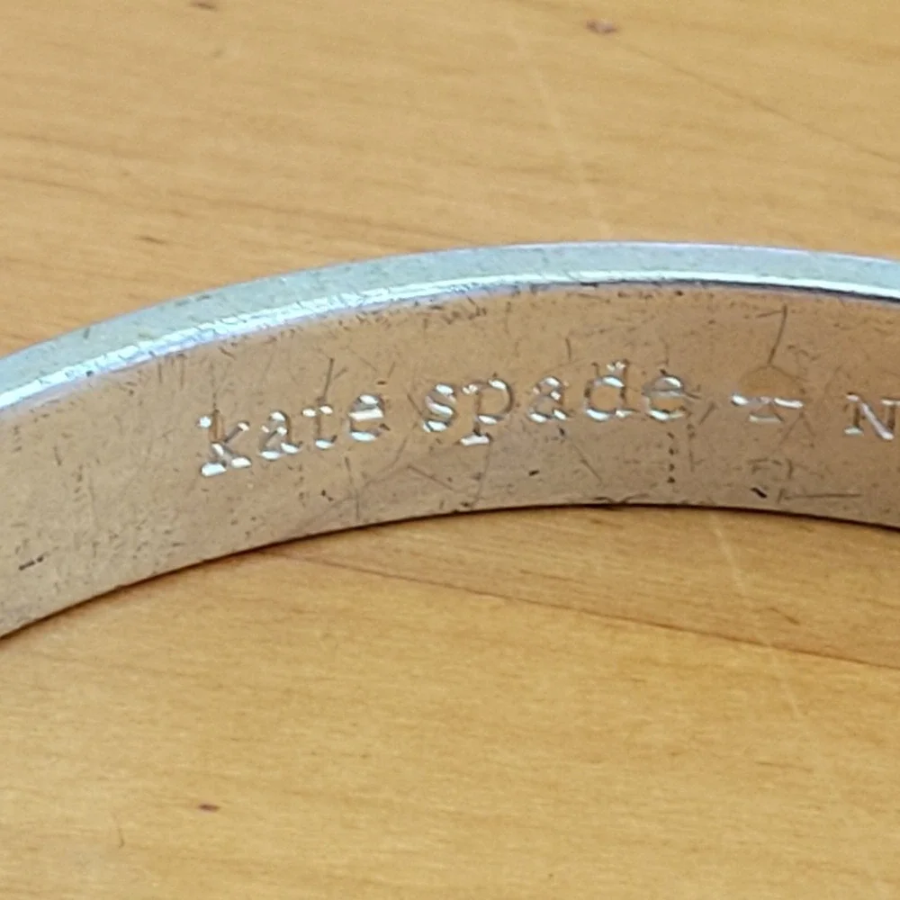 KATE SPADE Be Mine Idiom Silver Tone Engraved Bangle Bracelet